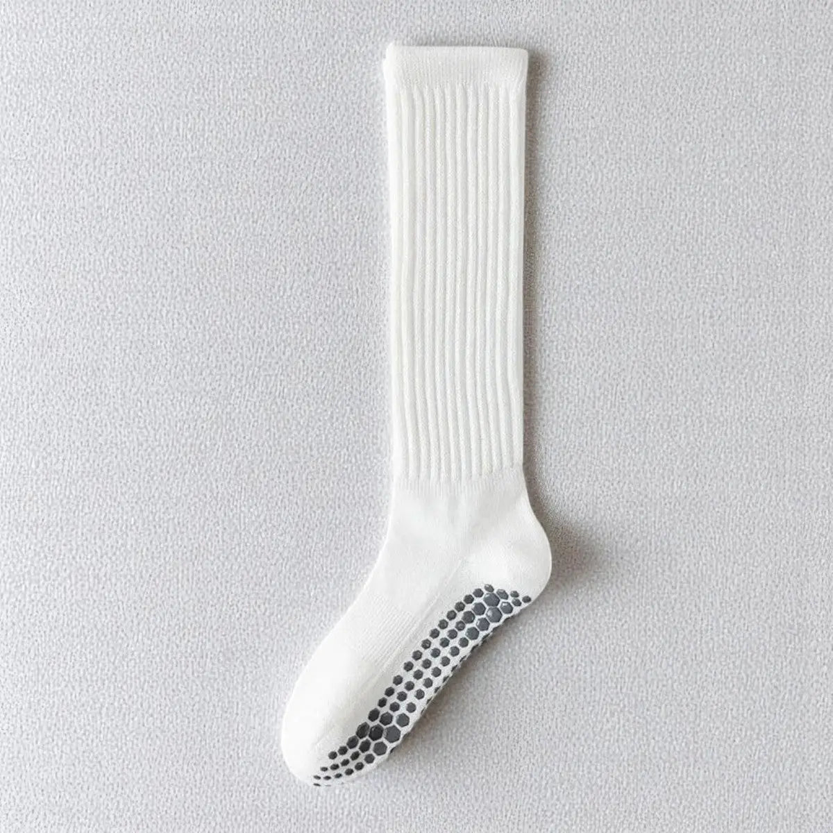 Chaussette femme antidérapante blanche longue, design sobre avec semelle grip discrète.