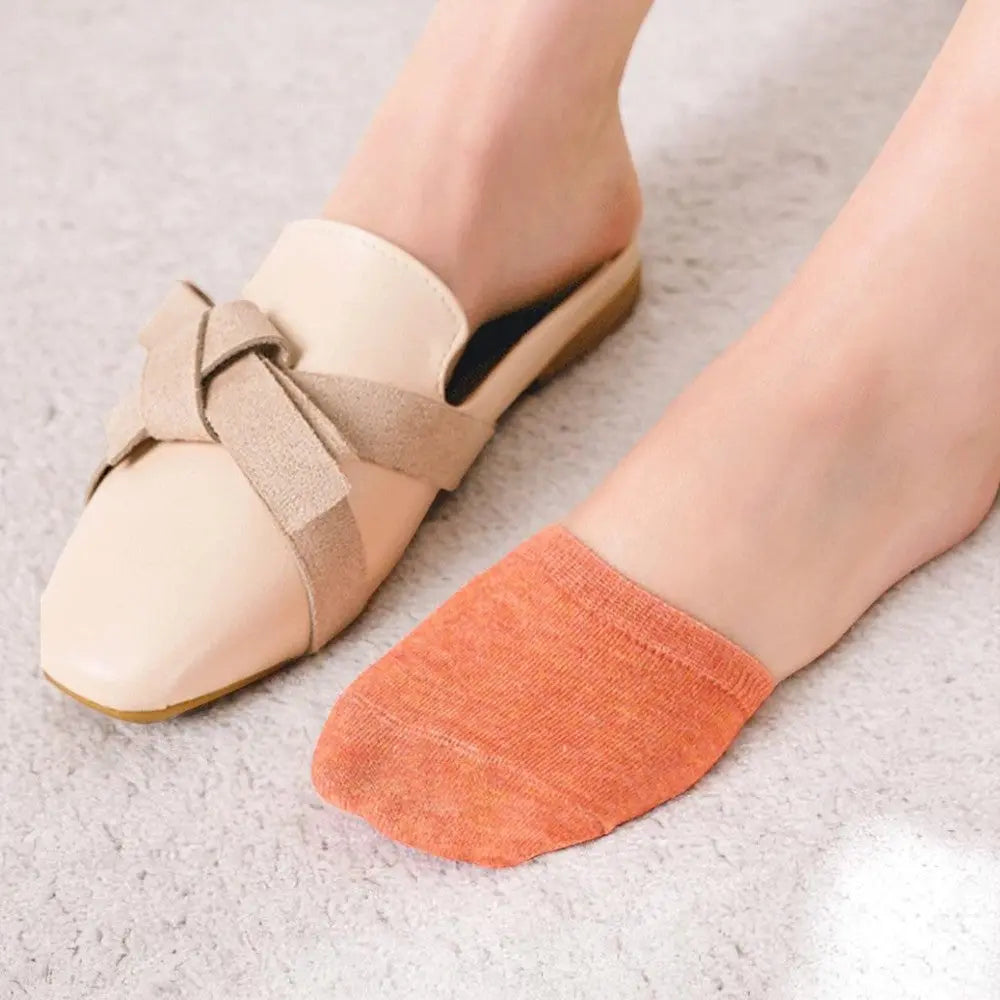 Chaussette demi-pied orange portée avec des chaussures ouvertes, idéale pour rester invisible.