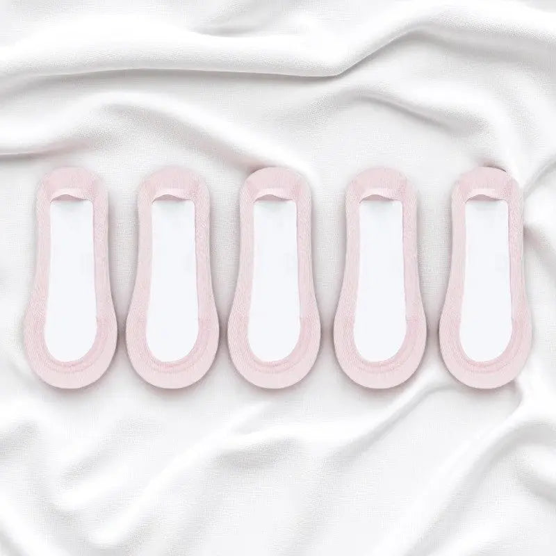 Chaussettes rose clair sans couture invisibles pour femme.