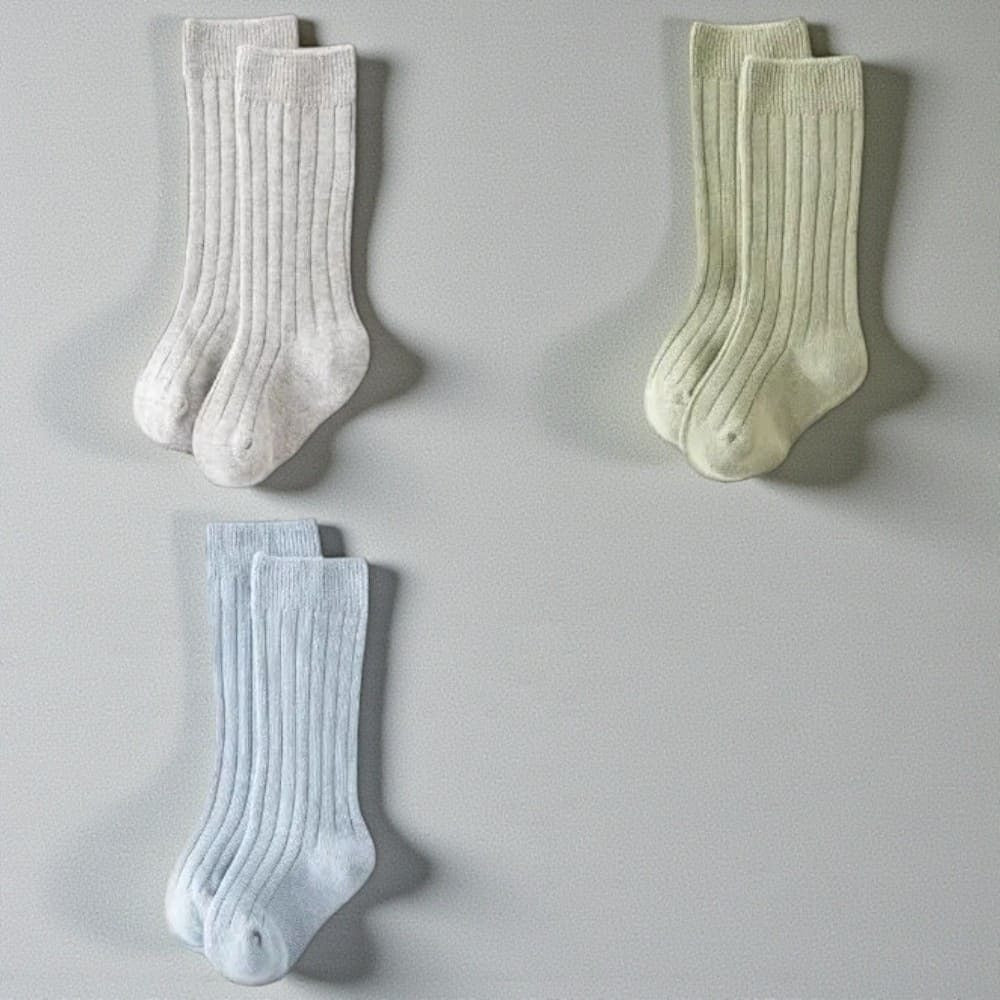 Chaussettes hautes enfant aux couleurs pastel douces et élégantes.