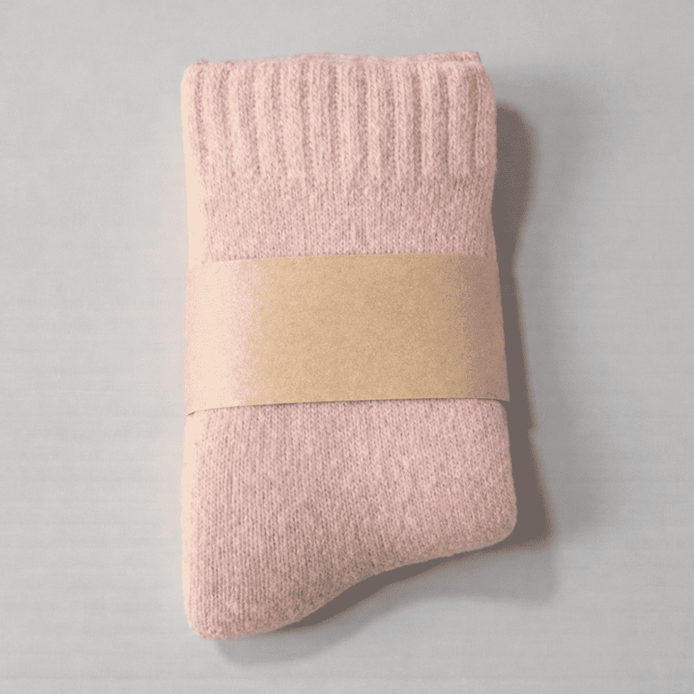 Chaussette laine enfant rose pâle douce et chaude.