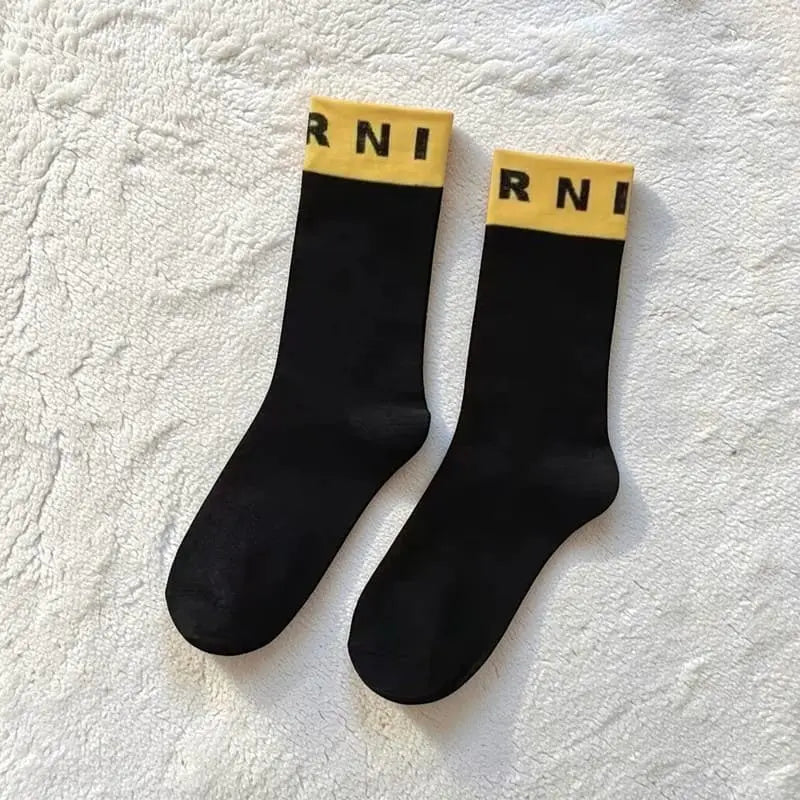 Chaussettes femme coton noir avec bande jaune Marni.