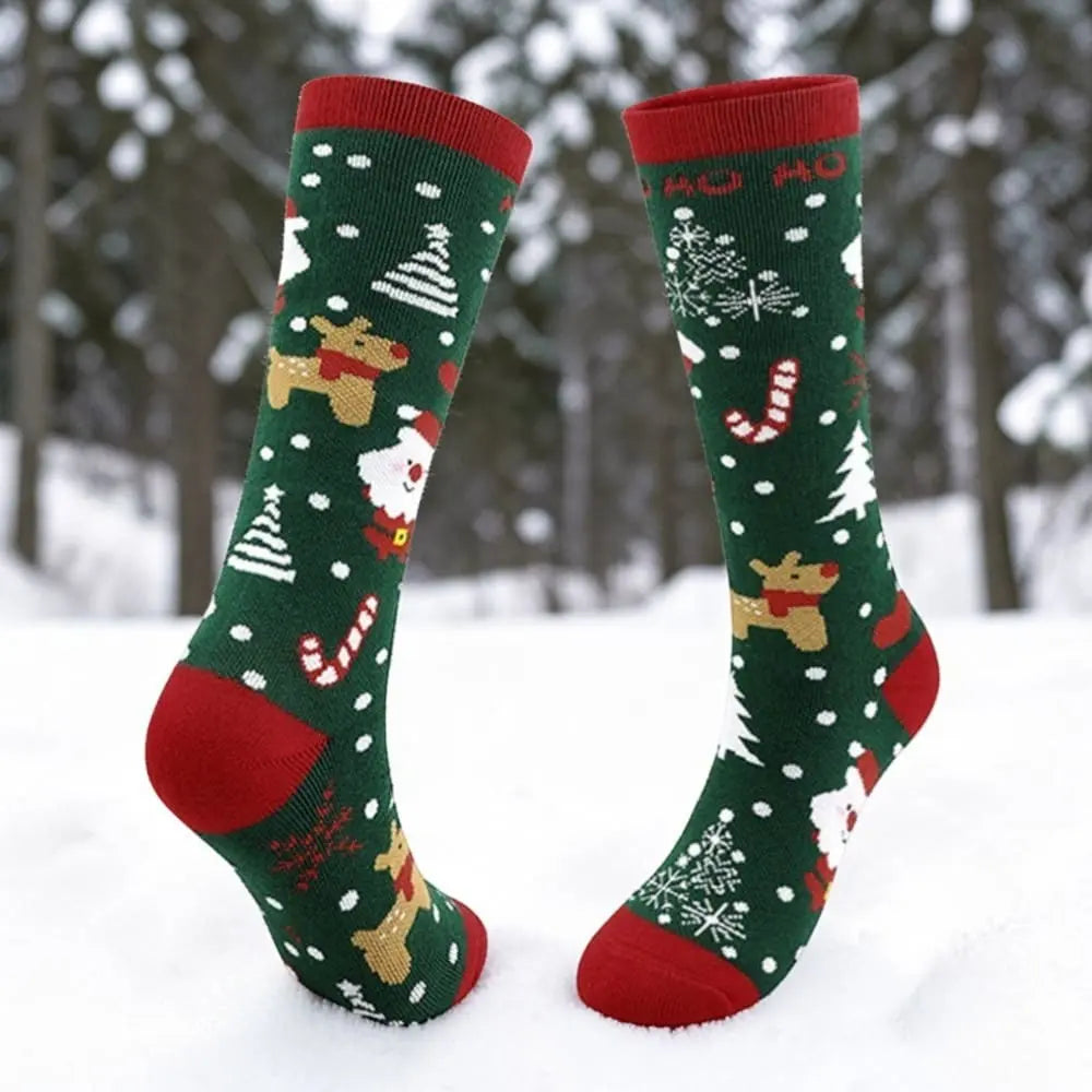 Chaussettes ski enfant verte motif Noël renne et flocons.