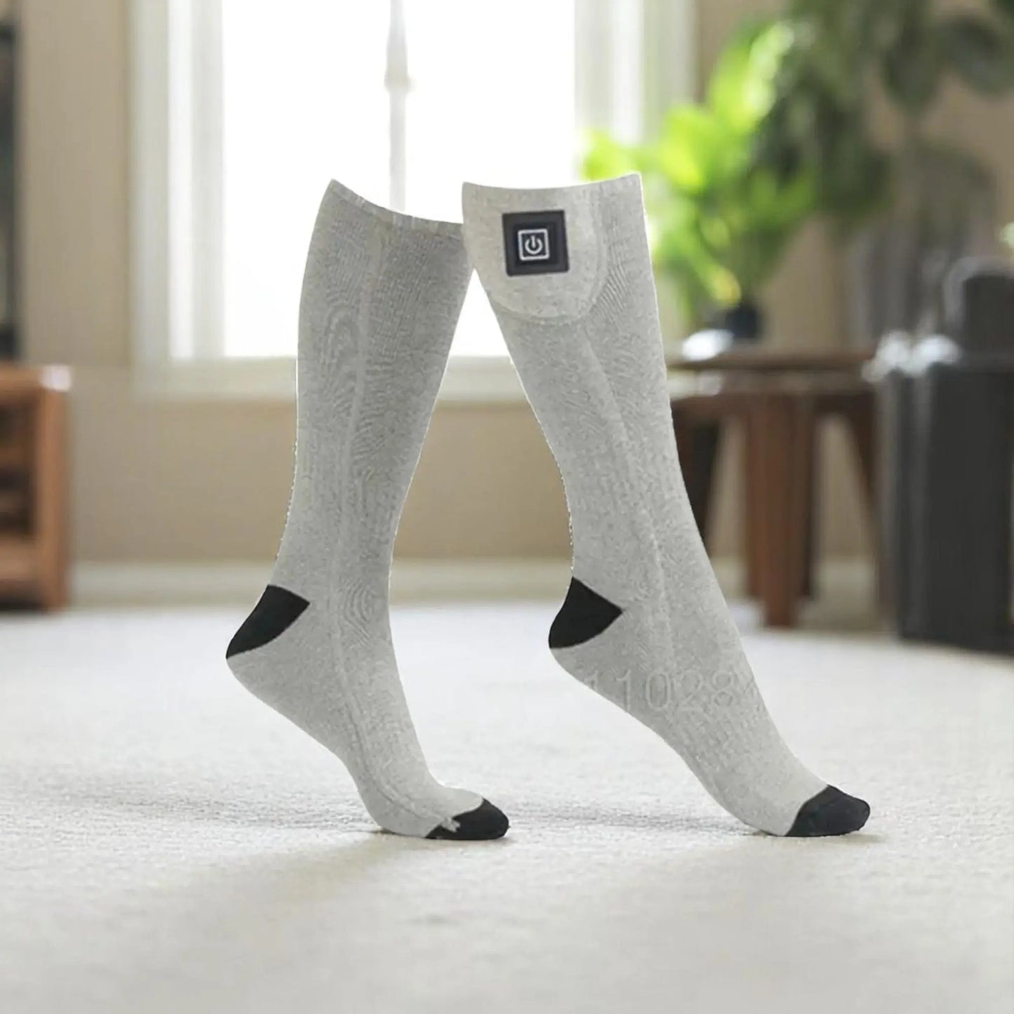 Chaussettes thermiques connectées grises pour homme chauffage intelligent.