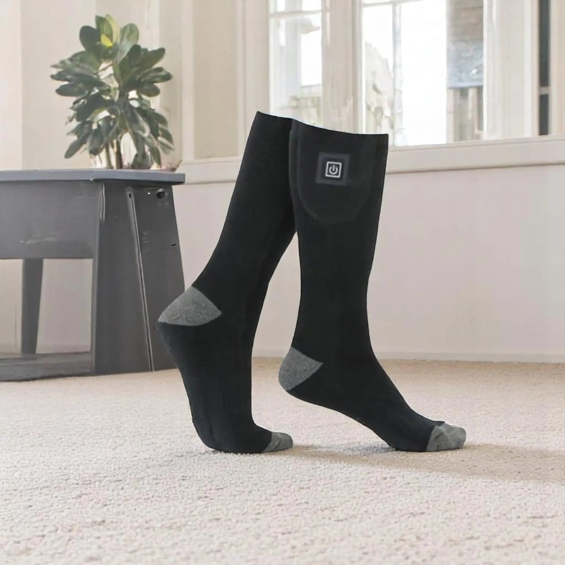 chaussettes chauffantes noires connectées homme technologie thermique.