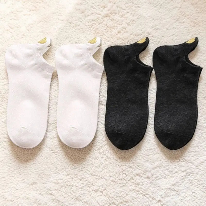 Lot de socquettes femme coloris blanc et noir avec languette talon.